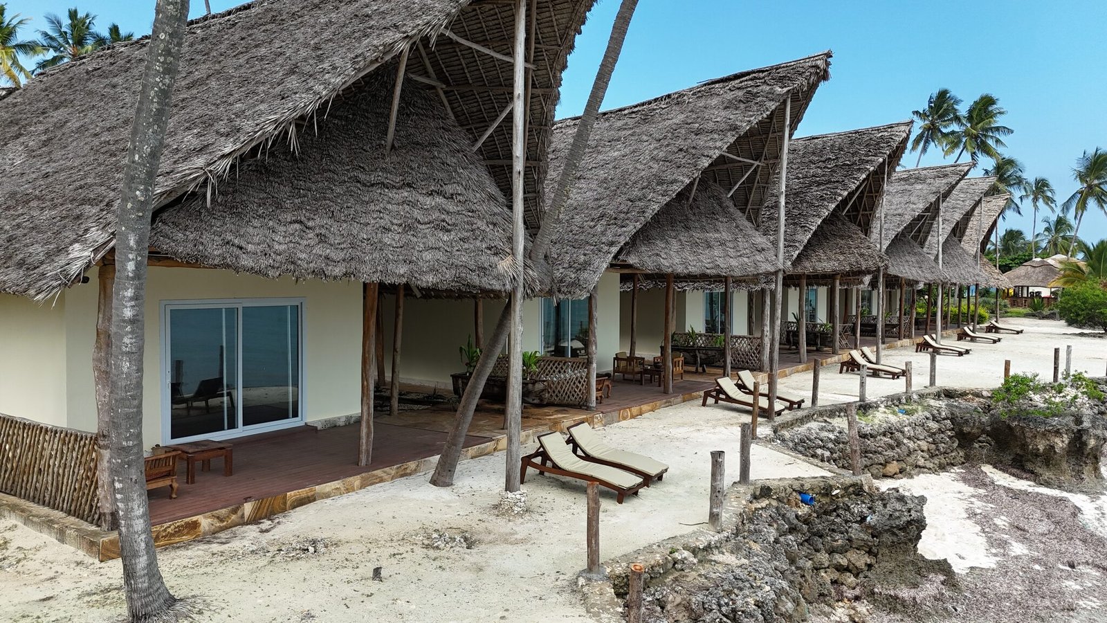 Beachfront thatched villas seen from above