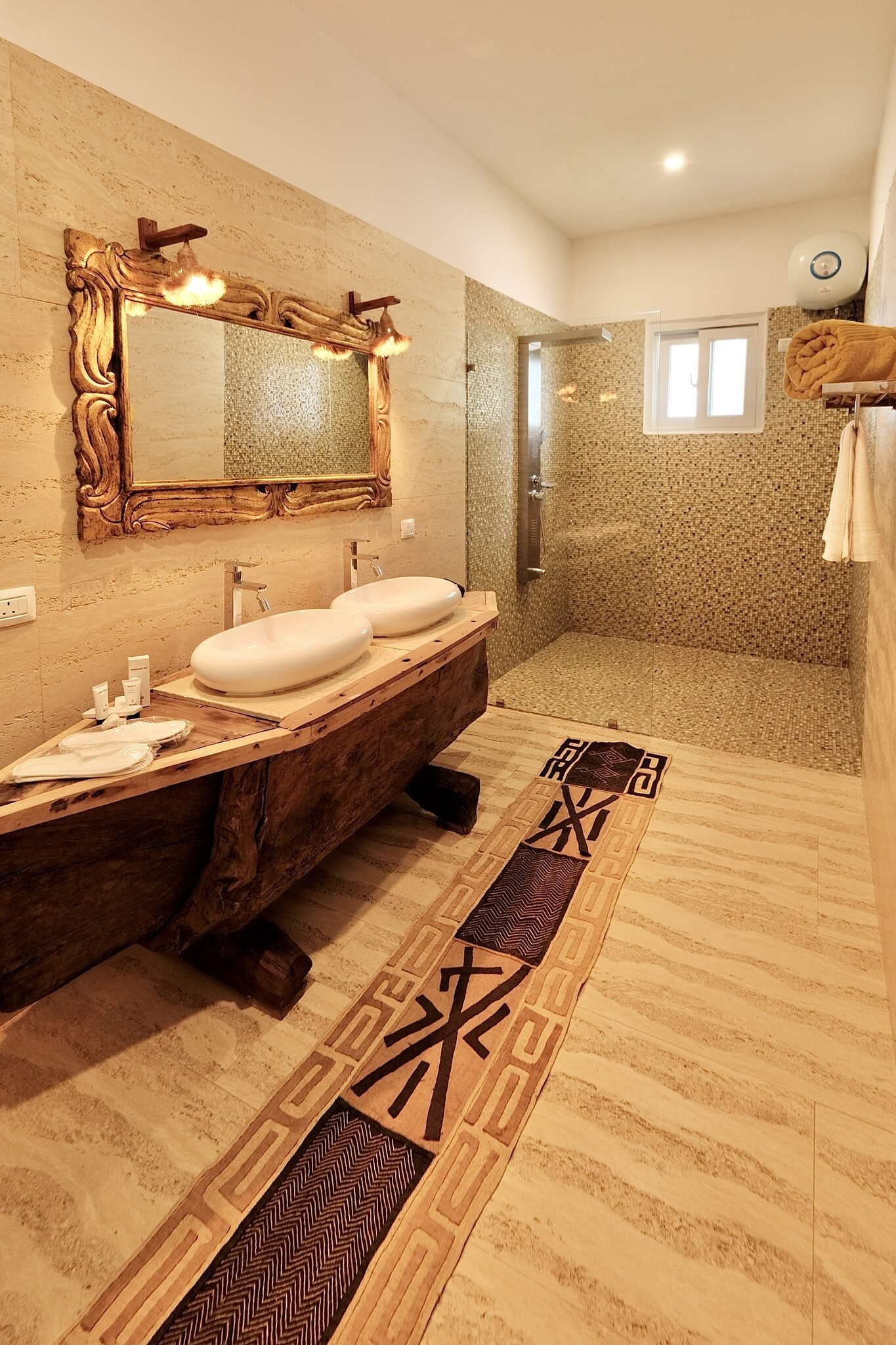 Luxury Villa bathroom with hand-carved mirror and twin basins