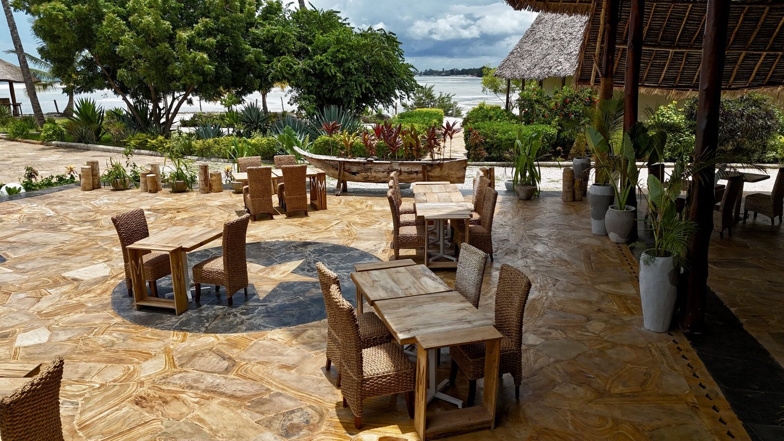 Garden terrace dining surrounded by tropical planting