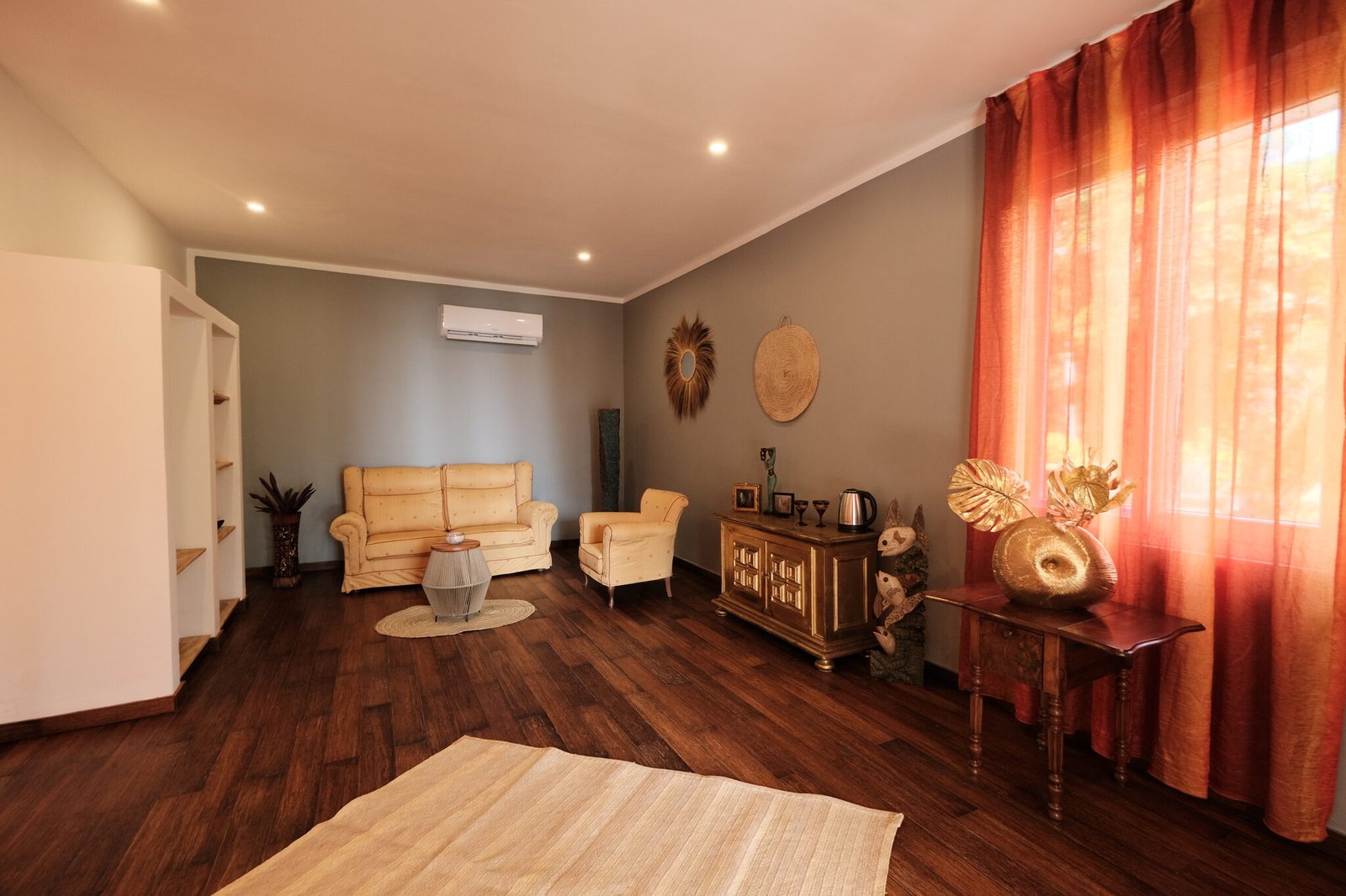 Villa Deluxe spacious living room with sofa and curtains
