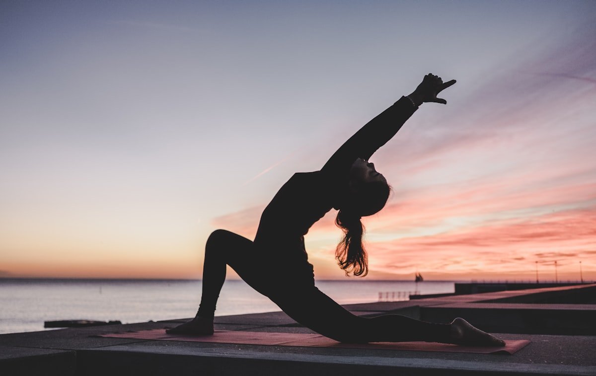 Private yoga session at sunset by the ocean